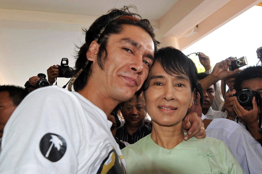Myanmar democracy icon Aung San Suu Kyi (right) and her son Kim Aris pose for pictures in Yangon in July 2011. Photo: AFP