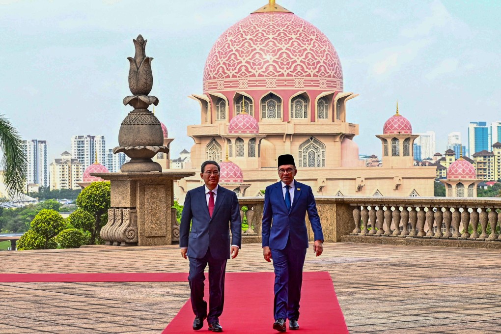 China’s Premier Li Qiang (left) and Malaysia’s Prime Minister Anwar Ibrahim after a welcoming ceremony in Putrajaya on Wednesday. Photo: AFP