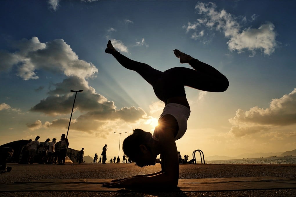 Yoga’s many physical and mental benefits have long been touted by its practitioners, and science is starting to reinforce some of their claims, finding evidence it lowers stress, relieves pain and makes you happier. Photo: Felix Wong
