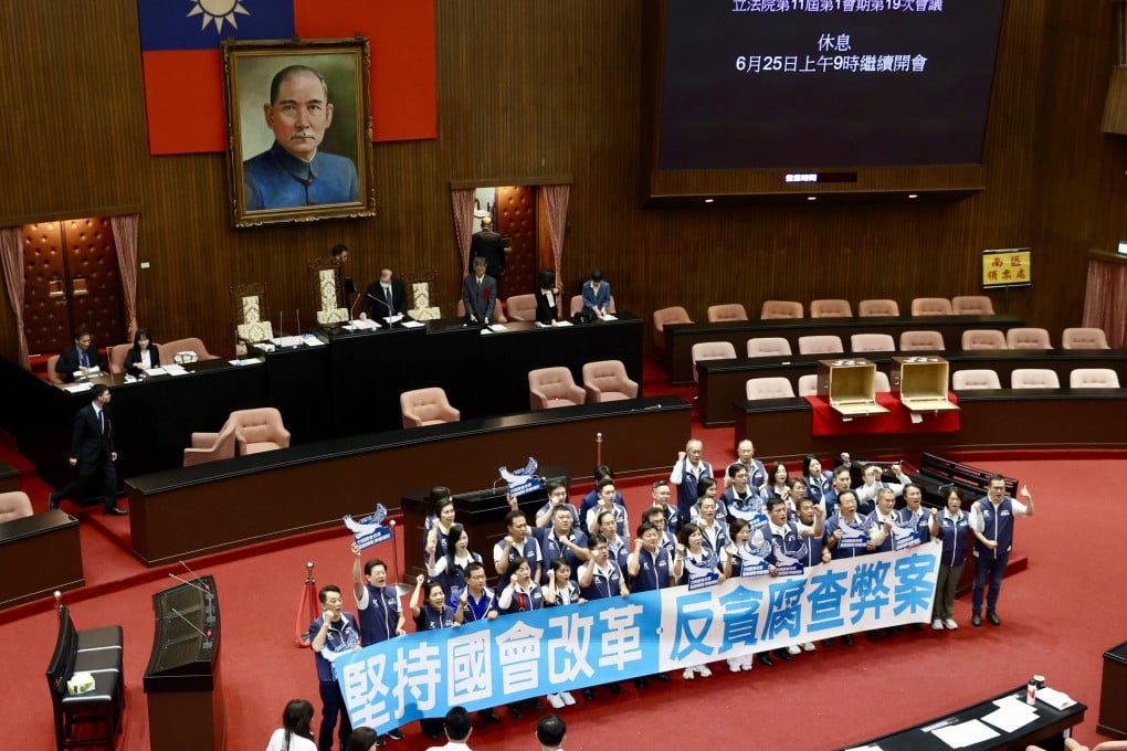 Legislators from Taiwan’s main opposition party the Kuomintang celebrate after overturning an executive veto on their parliamentary reform bills on Friday. Photo: EPA