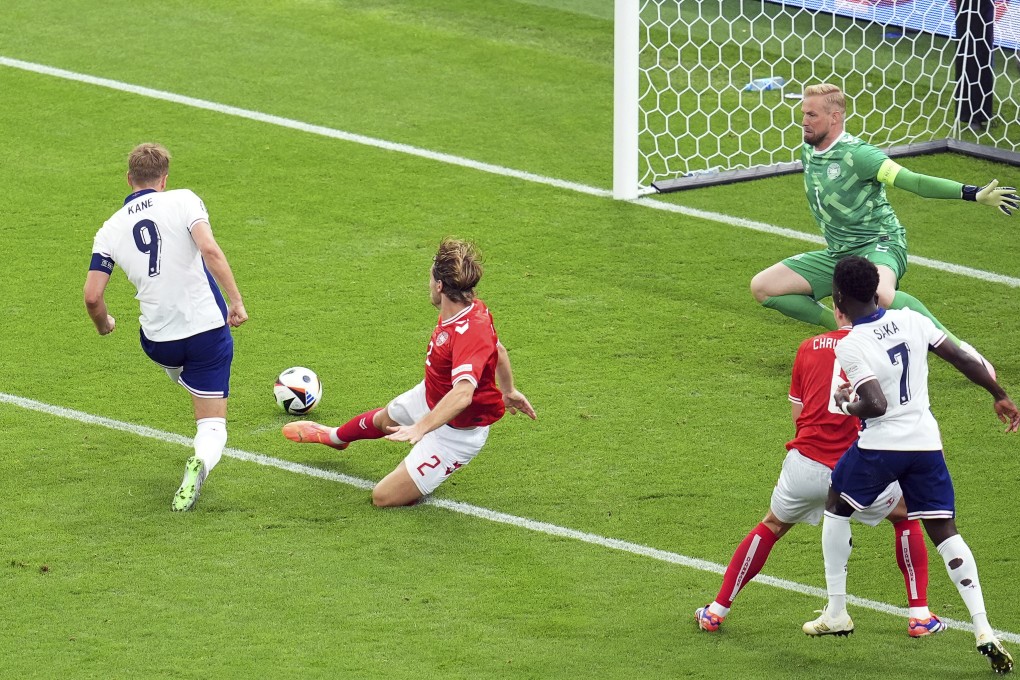 England’s Harry Kane (left) scores the opening goal against Denmark in Frankfurt. Photo: AP