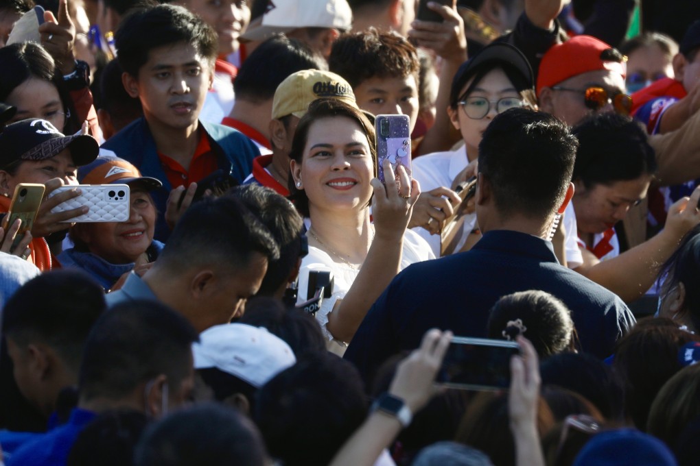 Philippine Vice-president Sara Duterte (centre) takes a selfie with her supporters during a January rally in Manila. Photo: EPA-EFE