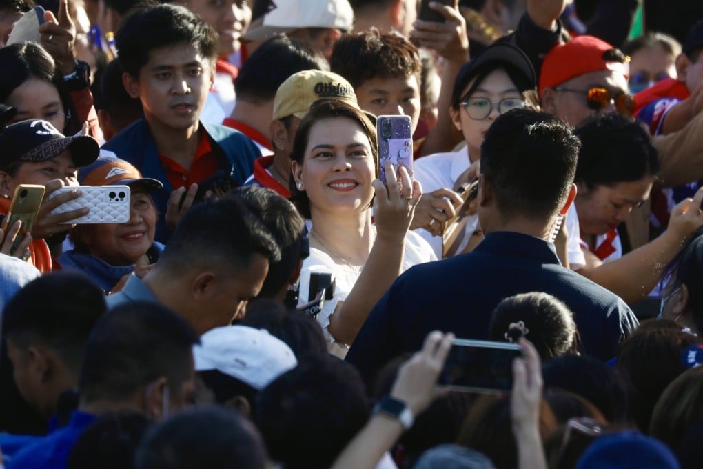 Philippine Vice-president Sara Duterte (centre) takes a selfie with her supporters during a January rally in Manila. Photo: EPA-EFE