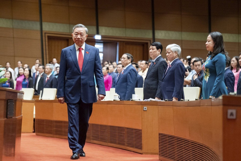 To Lam walks to the podium to take office as the Vietnamese president at the National Assembly in Hanoi on May 22. Photo: AP