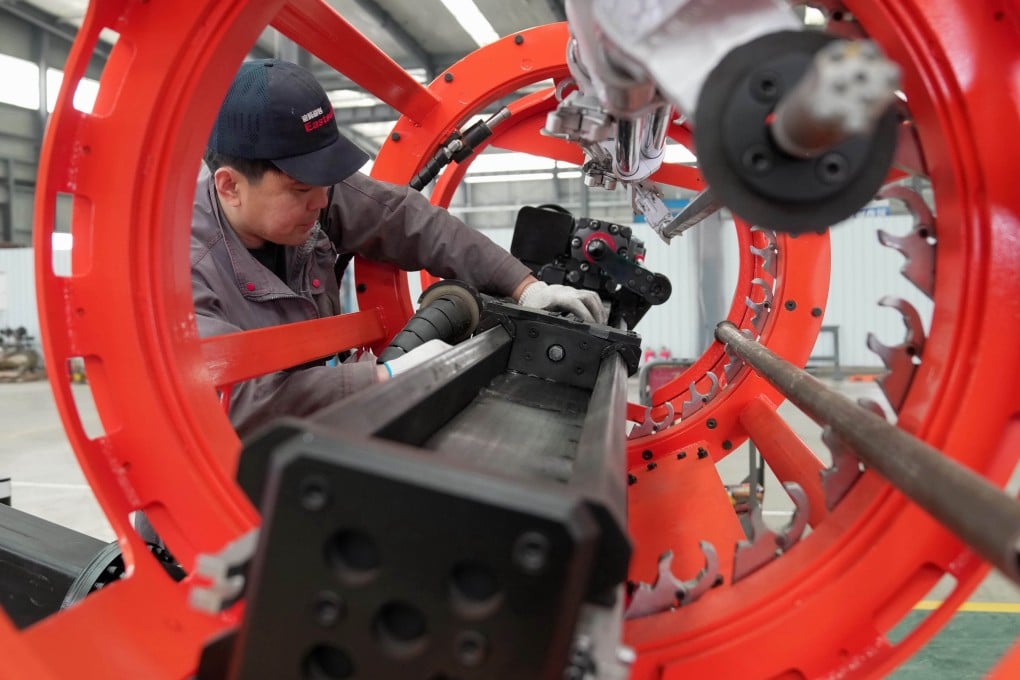A man works at a workshop of a mechanical equipment enterprise in north China’s Hebei Province. Photo: Xinhua