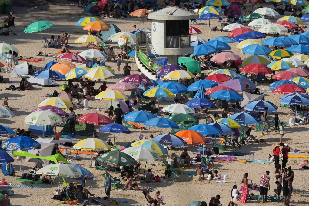 Beachgoers enjoy a sunny afternoon at Shek O beach on Buddha’s birthday holiday. Photo: May Tse