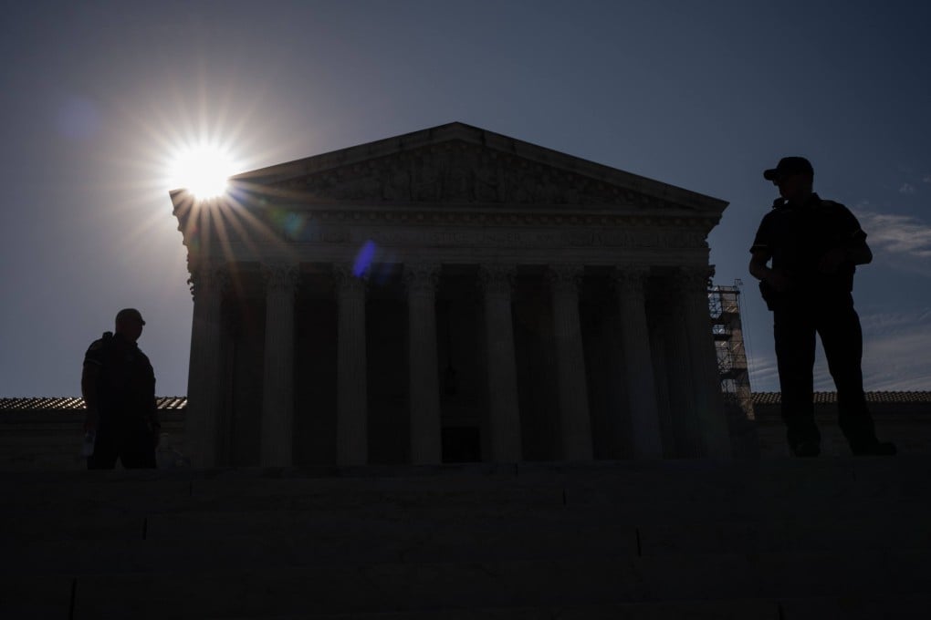 Police officers stand guard at the Supreme Court. The justices on Friday ruled 8-1 in favour of a 1994 ban on firearms for people under restraining orders to stay away from their spouses or partners. Photo: AFP