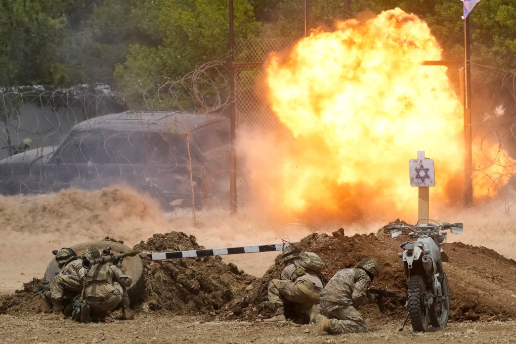Fighters from the Lebanese militant group Hezbollah carry out a training exercise. Photo: AP