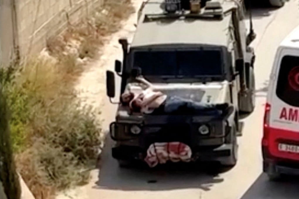 A Palestinian was strapped to a military jeep during raid in Jenin, in the Israeli-occupied West Bank, on Saturday. Photo: Reuters