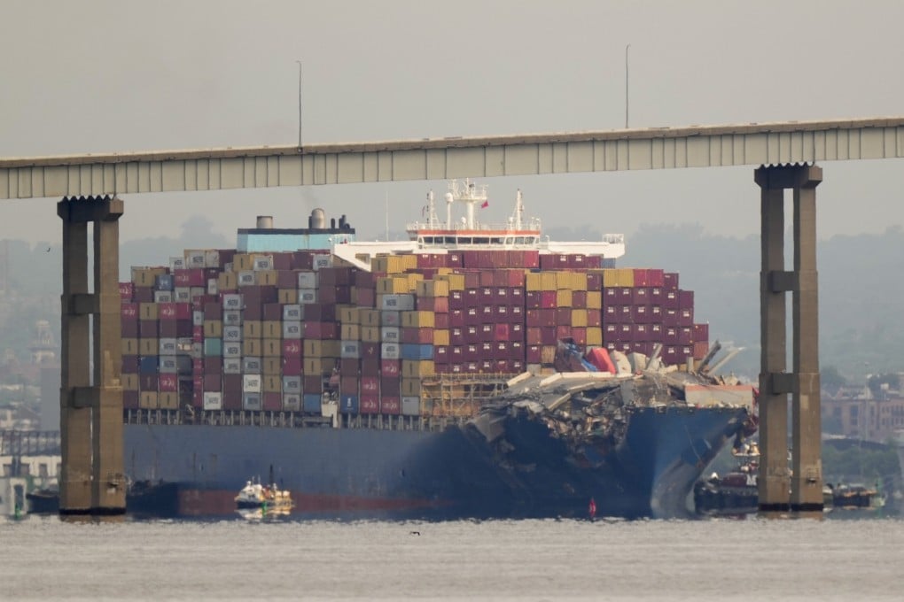 Tugboats escort the cargo ship Dali after it was refloated on May 20. On Monday, the ship left Baltimore 3 months after losing power and hitting the Francis Scott Key bridge’s supporting columns.