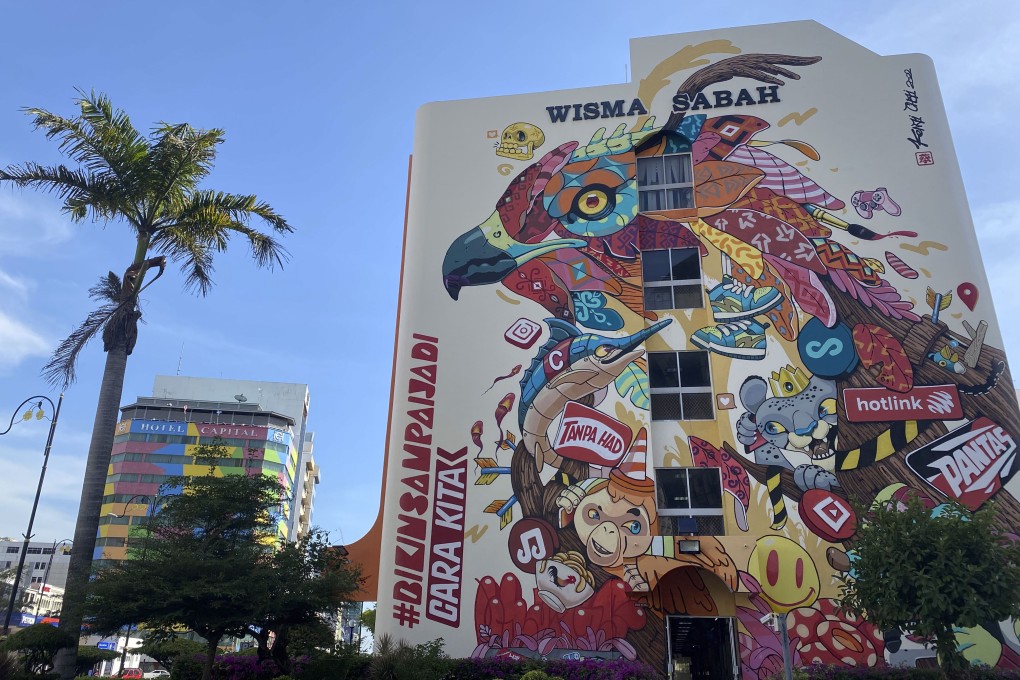 A mural on a mall in Kota Kinabalu, Malaysia, advertises mobile-telephony provider Hotlink. The street art scene in the capital of Sabah state is flourishing, but big-brand sponsorship threatens to undermine its message of local pride. Photo: Tamara Hinson