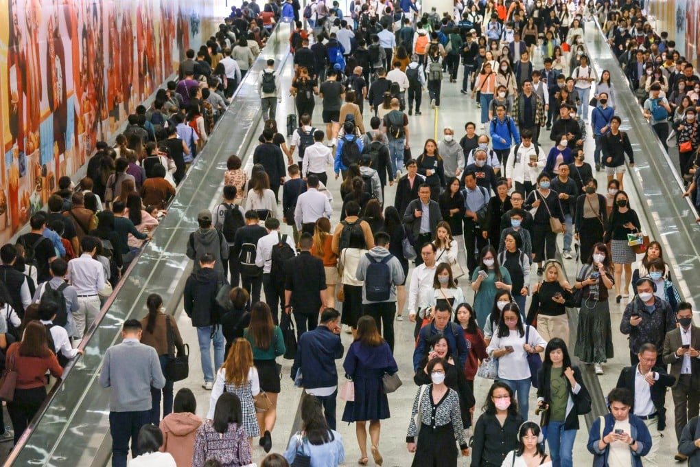 Commuters walk between the Central and Hong Kong MTR stations in the Central district of Hong Kong on February 20, 2024. Photo: May Tse