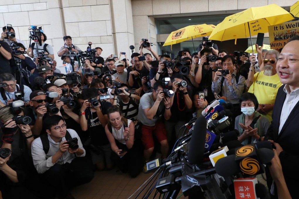 Benny Tai (right) speaks to the media outside West Kowloon Court in 2019. Photo: Robert Ng