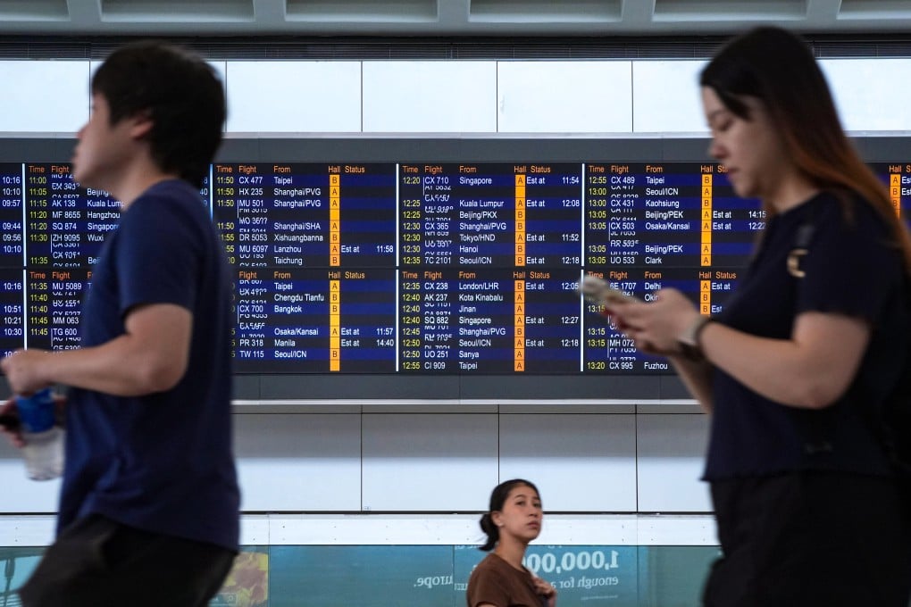 Airport passenger information screens were back online on Monday morning. Photo: Eugene Lee