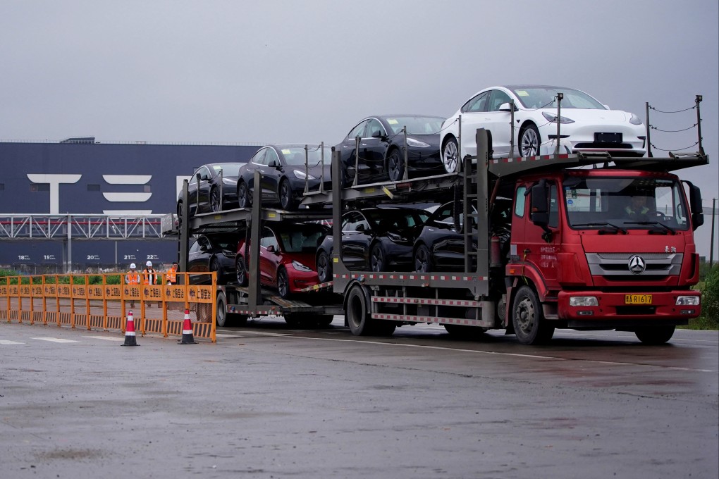 A lorry transports new Tesla cars from its factory in Shanghai. Photo: Reuters