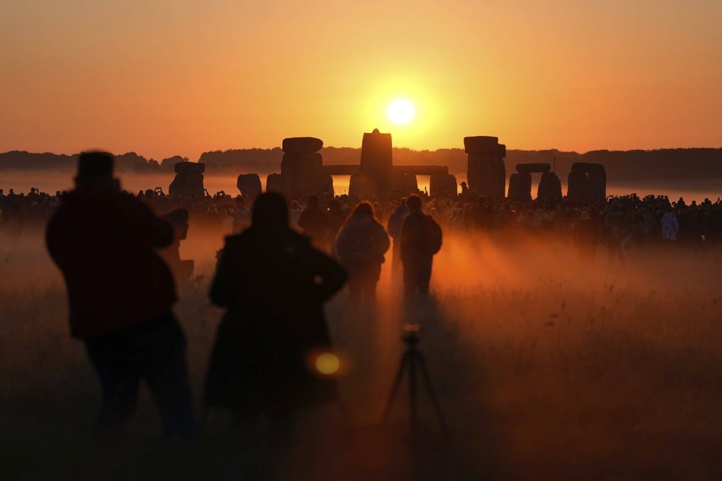 The sun rise on the summer solstice at Stonehenge in Wiltshire, England on June 21, 2024. A United Nations committee has recommended Stonehenge be added to Unesco’s list of World Heritage sites in danger. Photo: AP