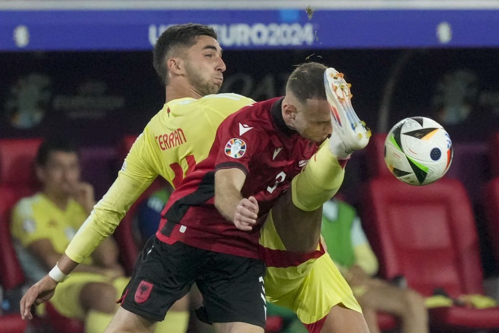Albania’s Mario Mitaj (front) vies for the ball with Spain’s Ferran Torres during their teams’ Euro 2024 clash. Photo: AP