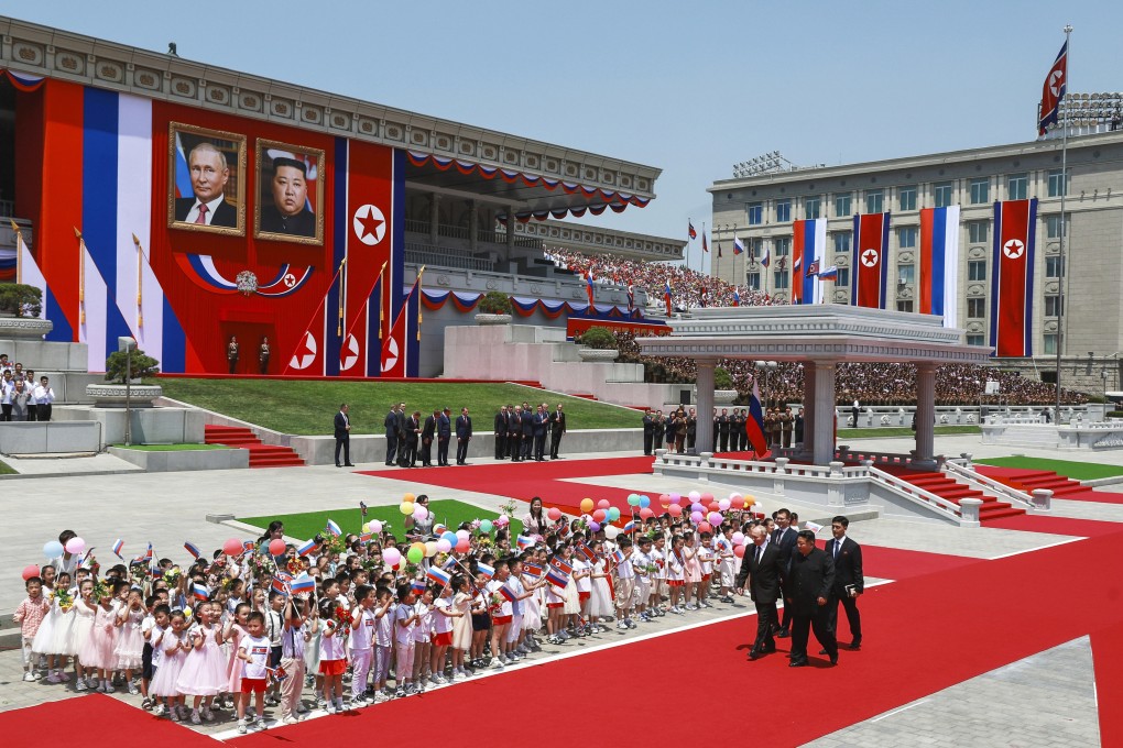 Russian President Vladimir Putin (left) and North Korea’s leader Kim Jong-un (foreground right) attend an official welcome ceremony for Putin in the Kim Il Sung Square in Pyongyang, North Korea, on June 19. China appears to be keeping its distance as Russia and North Korea move closer to each other with a new defence pact that could tilt the balance of power in Northeast Asia. Photo: AP