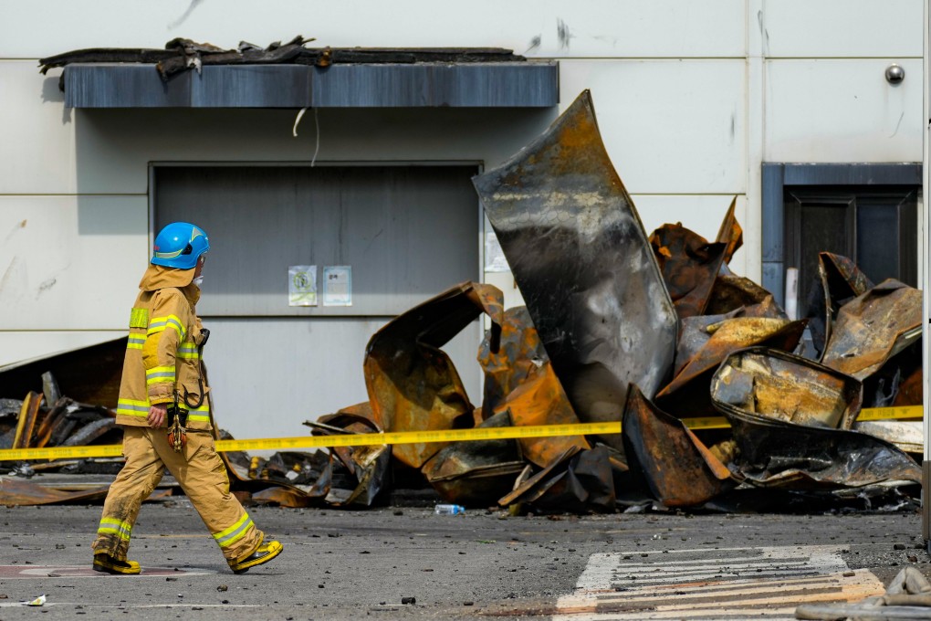 On Tuesday, Korean rescue workers were combing through the charred ruins of a factory building near South Korea’s capital, a day after a devastating blaze likely triggered by exploding lithium batteries killed 23 people, mostly Chinese migrant workers. Photo: AP