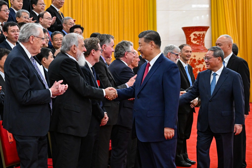 President Xi Jinping and other Politburo Standing Committee members meet representatives of the science award winners at the Great Hall of the People in Beijing on Monday. Photo: Xinhua