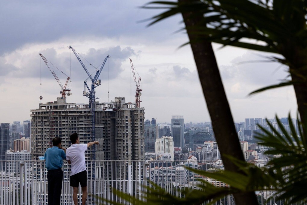 Buildings are seen under construction in Singapore earlier this year. Developers have grown more cautious on tackling new projects as the city state’s property market cools. Photo: Bloomberg