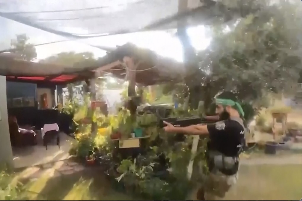 A Hamas militant attacking a location in southern Israel on October 7. File photo: Israel Defence Forces via AP