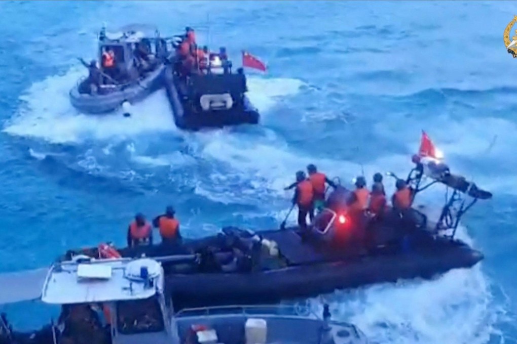 Chinese coastguard personnel aboard inflatable boats during a confrontation with Philippine Navy personnel near the Second Thomas Shoal in the South China Sea. Photo: AFP