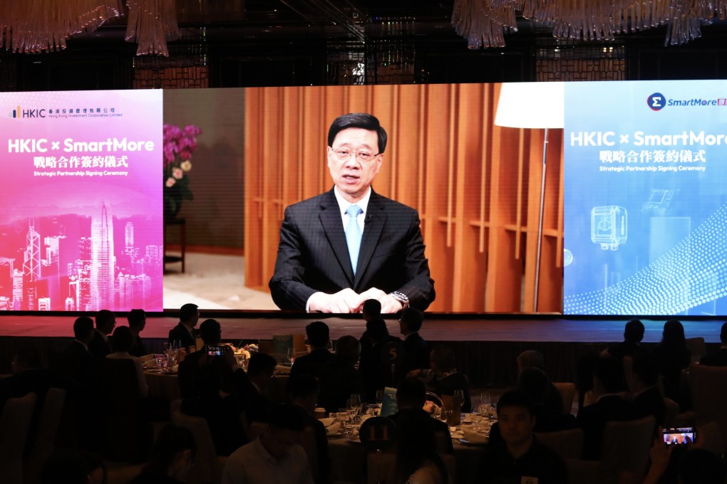 Chief Executive John Lee delivers a video message during the strategic partnership signing ceremony between Hong Kong Investment Corporation and Smartmore on June 12. Photo: Sun Yeung