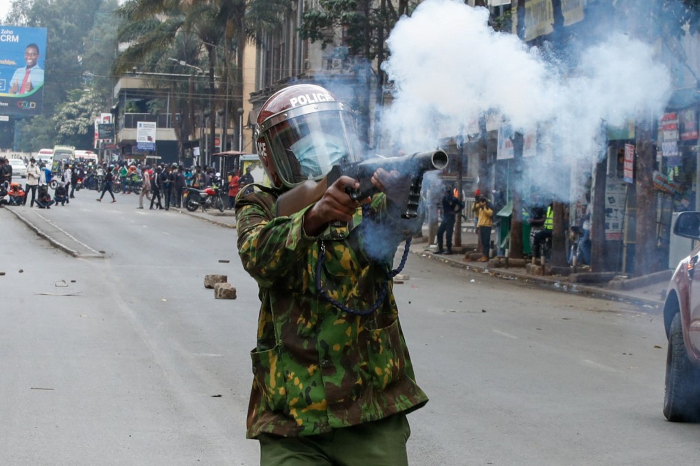 A police member fires tear gas at a demonstration over police killings of people protesting against Kenya’s proposed finance bill on Thursday. Photo: Reuters