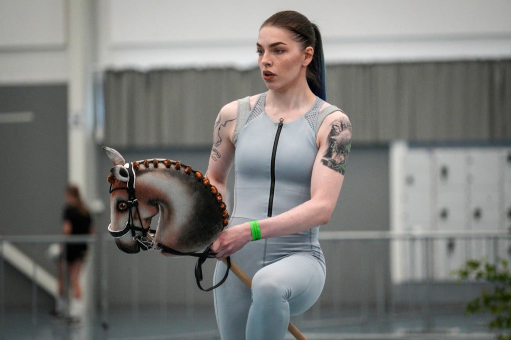 A participant competes in the dressage category of the 2024 Finnish Hobbyhorse Championships at the local sports arena in Seinajoki, Finland on June 15, 2024. The annual event, which also involves show jumping, is the world’s largest competition for the fledgling sport. Photo: AFP