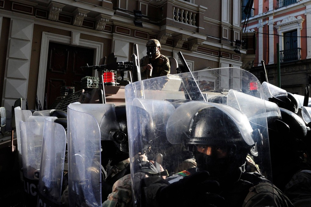 Military police stand guard outside Quemado Palace at Plaza Murillo in La Paz. Photo: AFP