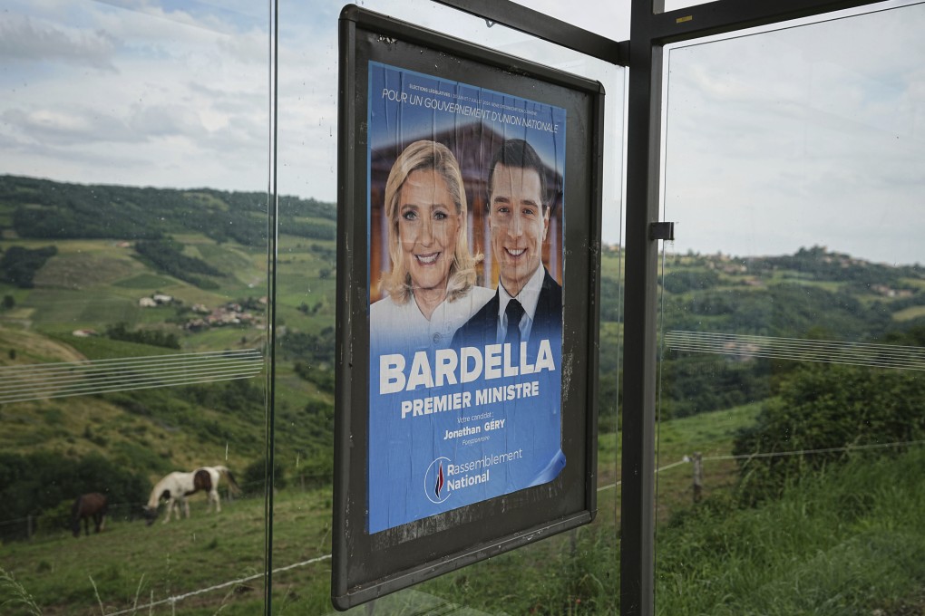 A campaign poster for the National Rally party of Marine Le Pen, featuring her candidate for prime minister, Jordan Bardella. Photo: AP