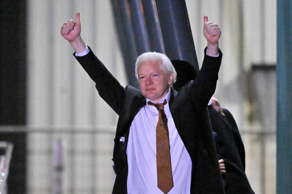 WikiLeaks founder Julian Assange waves at supporters after arriving at Canberra Airport, in Canberra, Australia, on Wednesday. Photo: EPA-EFE