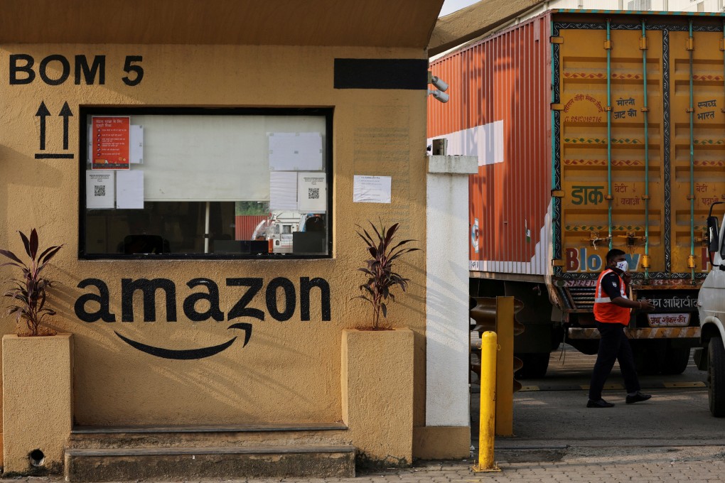 A man inspects trucks before they enter an Amazon storage facility on the outskirts of Mumbai, India, in October 2021. Photo: Reuters