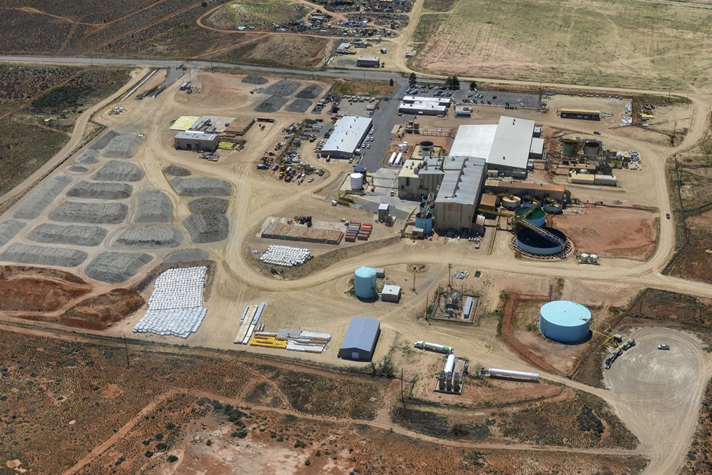 The ore pad at the White Mesa Mill on May 16, 2024. The suspected Japan Atomic Energy Agency containers can be seen at the centre bottom of the photo in a vertical white column beside the bright yellow area. Photo: Tim Peterson / EcoFlight