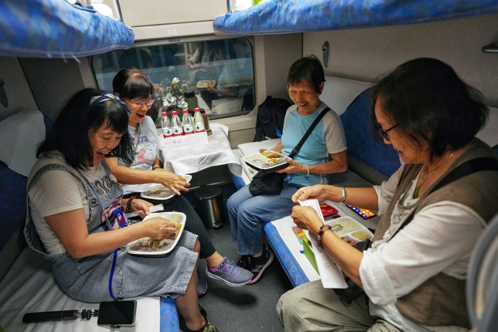 Passengers tuck in as a new high-speed sleeper train departs from West Kowloon station for Beijing on June 15. Photo: Elson Li