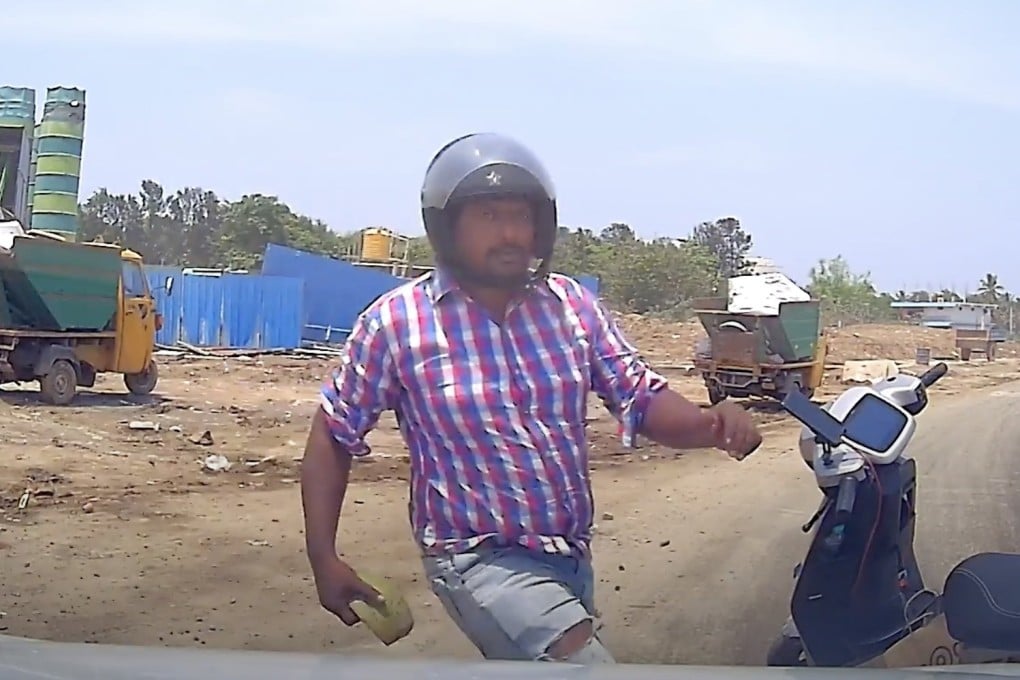 Dashcam footage captures the moment a biker gang member attacked a Bengaluru driver’s car with a coconut shell. Photo: Deepak Jain/Handout