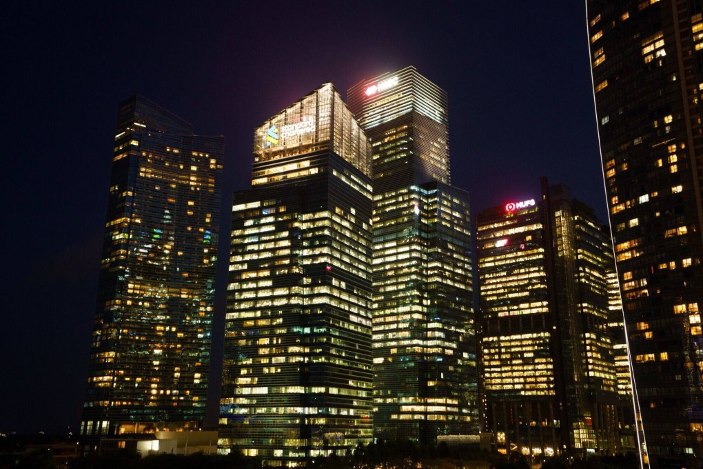 Commercial buildings in the central business district of Singapore at night. The city state ranks ahead of rival Asian hubs for low money laundering and terrorist financing risks. Photo: Bloomberg