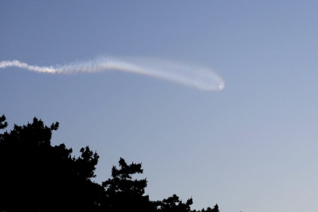 A vapour trail believed to be created by a North Korean missile is seen from Yeonpyeong island, South Korea, on June 26. Photo: Yonhap/AFP
