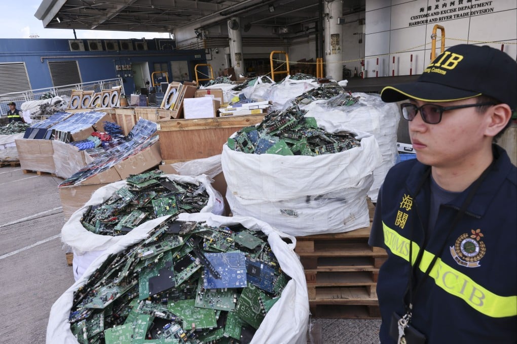 Customs officers have seized HK$100 million in smuggled goods, including mobile phones, computer components and vehicle parts. Photo: Jelly Tse