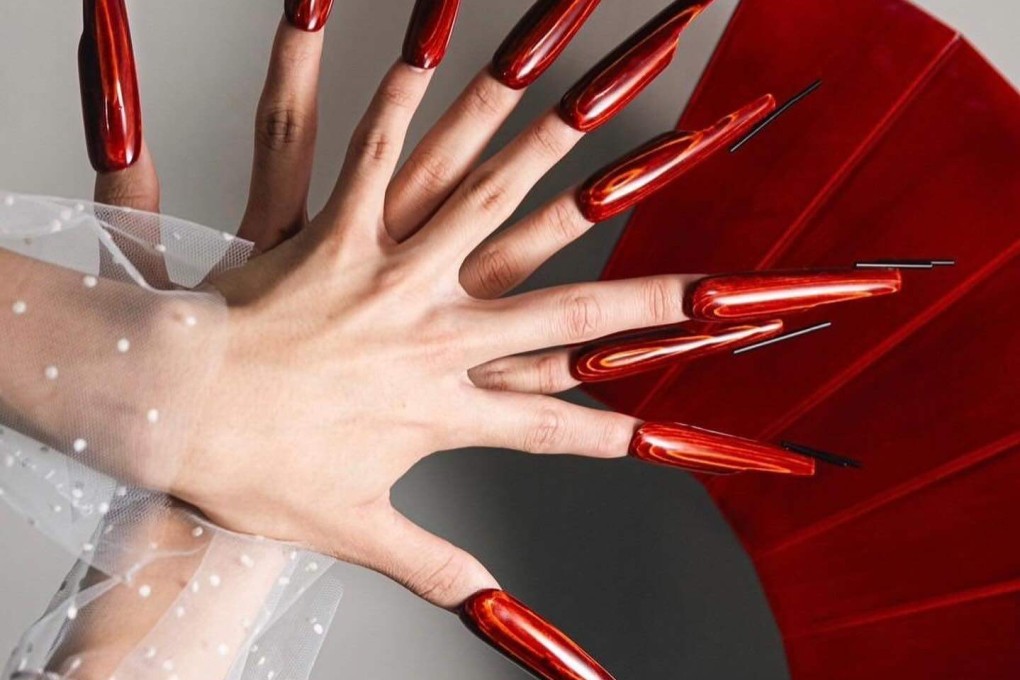 A nail artist is working with a traditional wood lacquerware craftsman in central Japan to create distinctive false nails that combine both arts. Photo: Instagram/@sucre_nail_