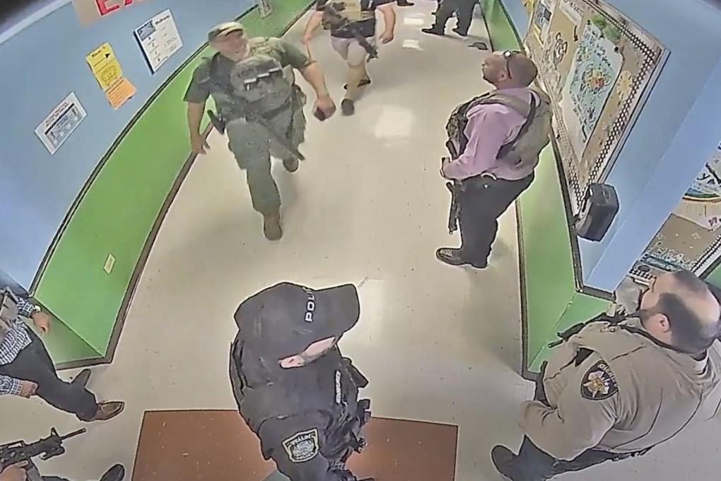 Police in in hallway at Robb Elementary School on May 24, 2022. File photo: Austin American-Statesman via AP