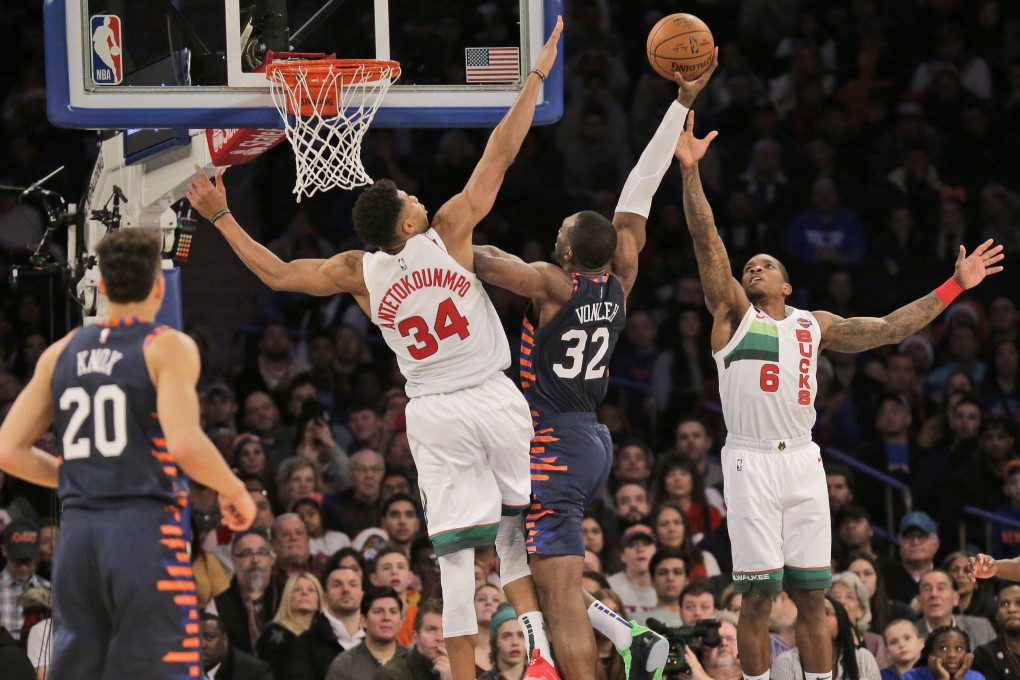 New York Knicks’ Noah Vonleh (centre), is defended by Milwaukee Bucks’ Eric Bledsoe and Giannis Antetokounmpo during the second half of an NBA game. Photo: AP