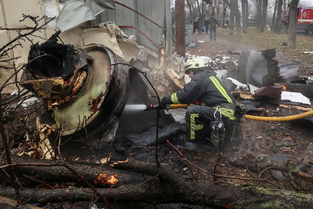 A firefighter hoses down the remains of an unidentified missile, which Ukrainian authorities claimed to be made in North Korea, at a site of a Russian strike in Kharkiv, Ukraine, in January. Photo: Reuters