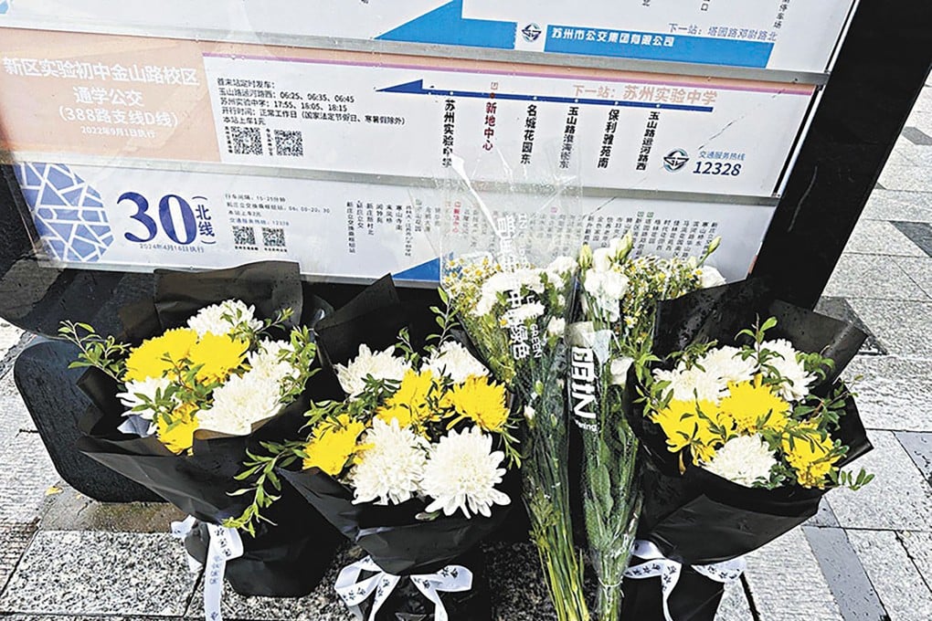 Flowers lay in tribute in Suzhou to school bus attendant Hu Youping died on Wednesday from wounds she sustained trying to subdue a knife-wielding attacker at a bus stop. Photo: Weibo