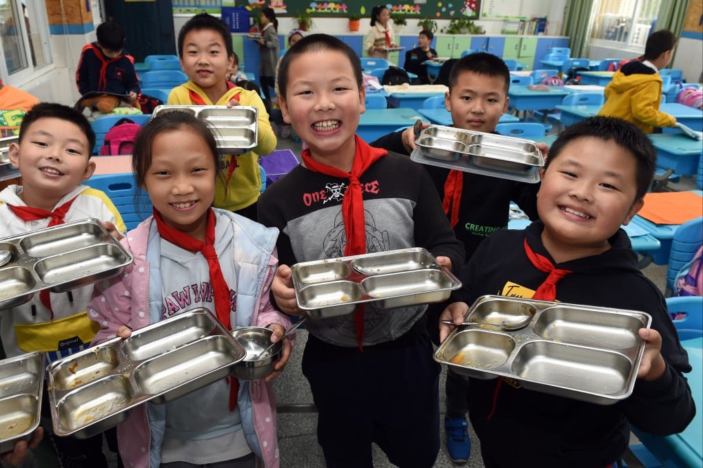 Providing meals at school in poorer areas have been shown to improve not only nutrition levels but cognitive abilities, academic performance and class enrolment rates as well. China introduced its rural school meal plan in 2011. Photo: Xinhua