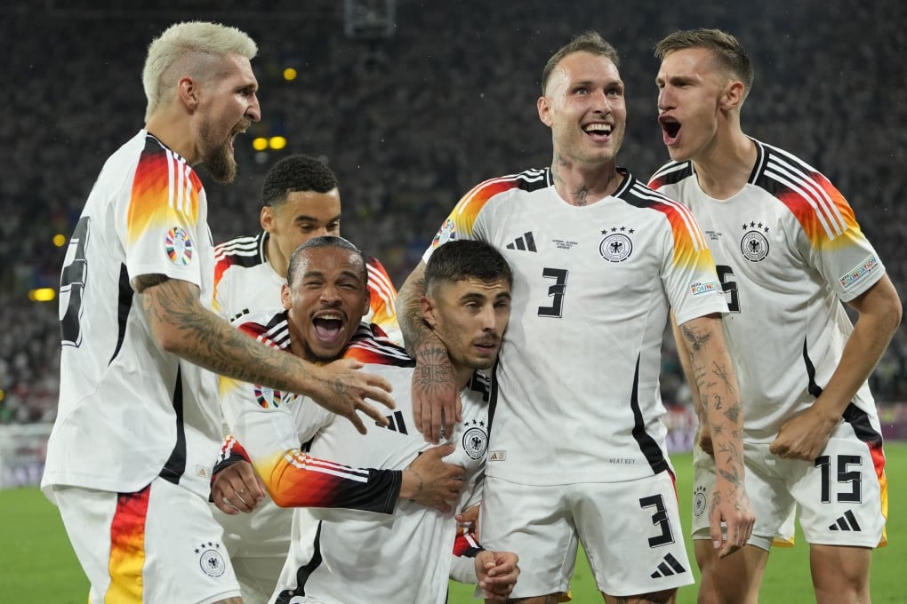 Germany’s players celebrate with Kai Havertz after he opened the scoring in their last-16 victory over Denmark. Photo: AP