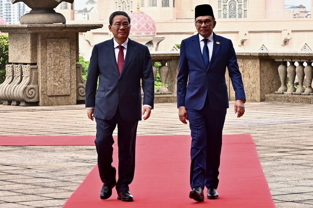 Chinese Premier Li Qiang (left) and Malaysian Prime Minister Anwar Ibrahim during a welcome ceremony at the prime minister’s office in Putrajaya, south of Kuala Lumpur, on June 19. Li’s official three-day visit was the latest entry in Chinese outreach to Malaysia that is seen in some quarters as trying to pull Putrajaya more into Beijing’s orbit. Photo: EPA-EFE