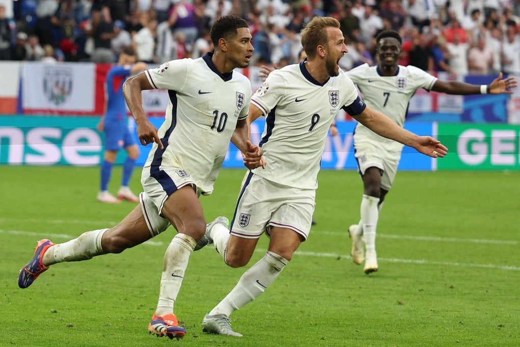 Jude Bellingham (left) and Harry Kane (centre) celebrate England’s equaliser at the Arena AufSchalke. Photo: AFP