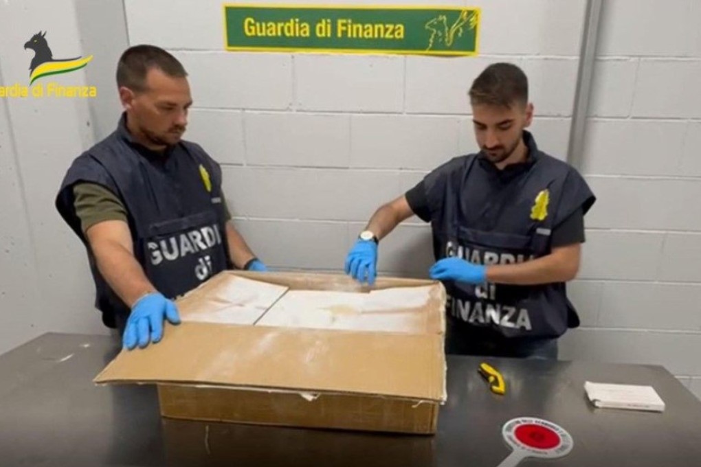 Italian officials open a box believed to contain drug precursors. Photo: Guardia di Finanza